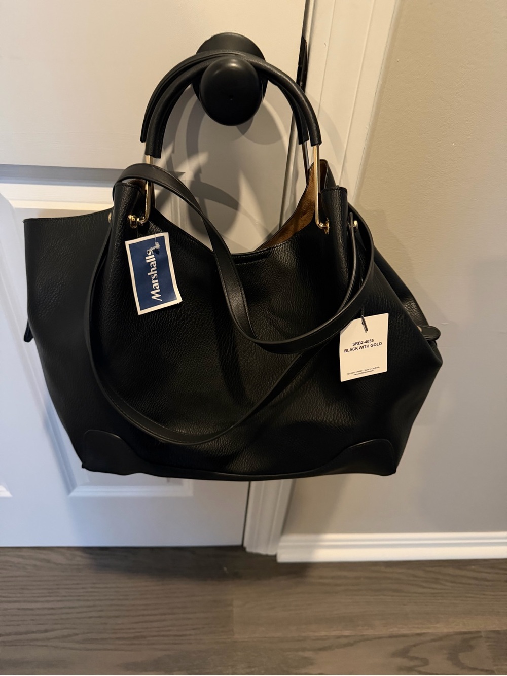 Sondra Robert’s Black Leather Tote Handbag with Gold Hardware